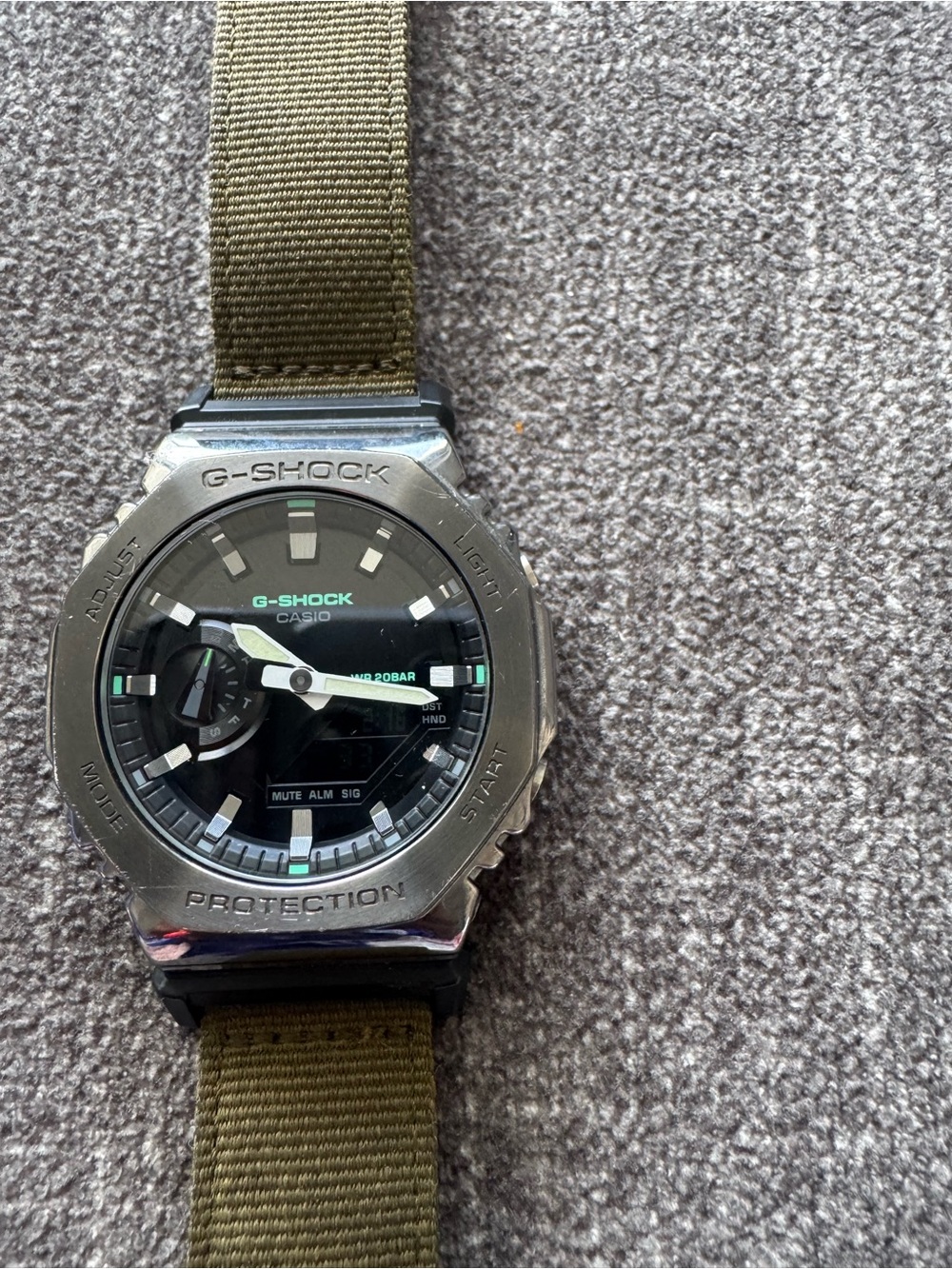 G-Shock Silver Bezel Black Dial Olive Green Fabric Strap Watch